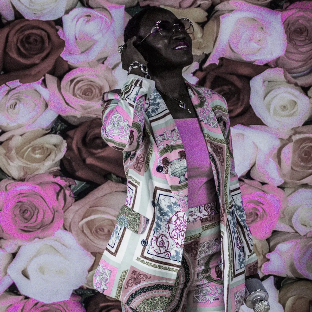 Charise styled in front of a pink rose backdrop